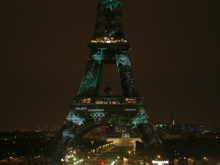 Eiffel Tower lit up in green