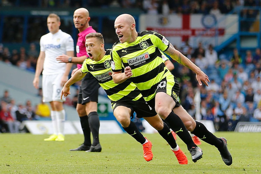 Aaron Mooy celebrates a goal for Huddersfield Town