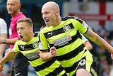 Aaron Mooy celebrates a goal for Huddersfield Town