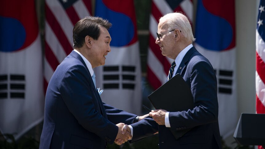 US President Joe Biden and Yoon Suk Yeol, South Korea's president, shake hands at a news conference in Washington, DC