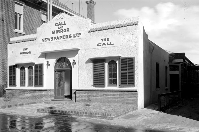 Black and white photo of outside of newspaper offices for the The Call and the Mirror