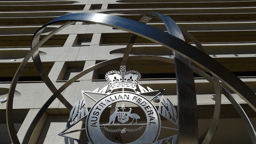 The AFP logo at the organisation's headquarters.