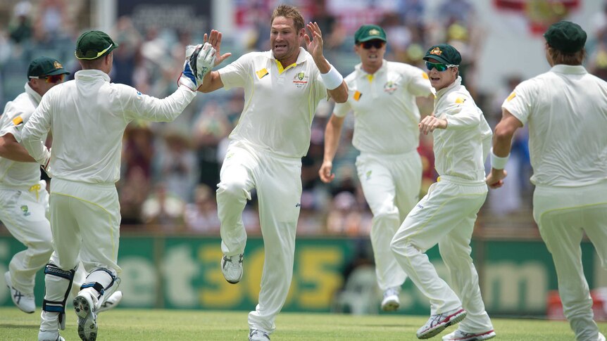 Australia's Ryan Harris (C) reacts after dismissing England captain Alastair Cook at the WACA.