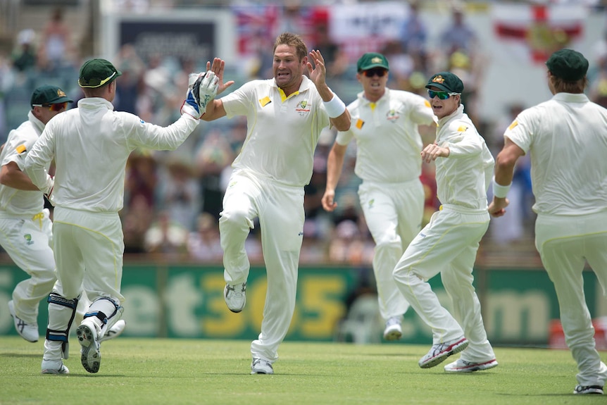 Australia's Ryan Harris (C) reacts after dismissing England captain Alastair Cook at the WACA.