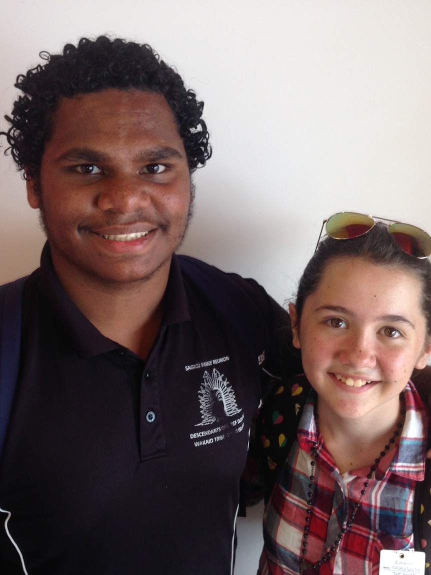 Royston Sagigi and Carli Addison stand arm in arm on their way to a Creative generation rehearsal in Brisbane.