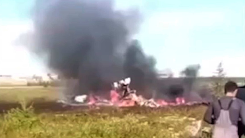 Smoke rises from the crash of a Russian helicopter.