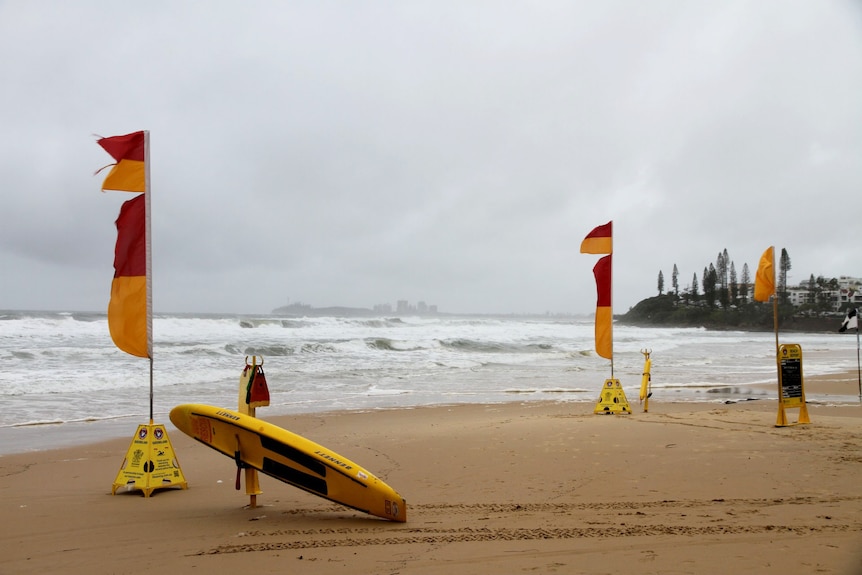 Wild surf whips up with rainy weather at Alexandra Headlands on the Sunshine Coast this morning.