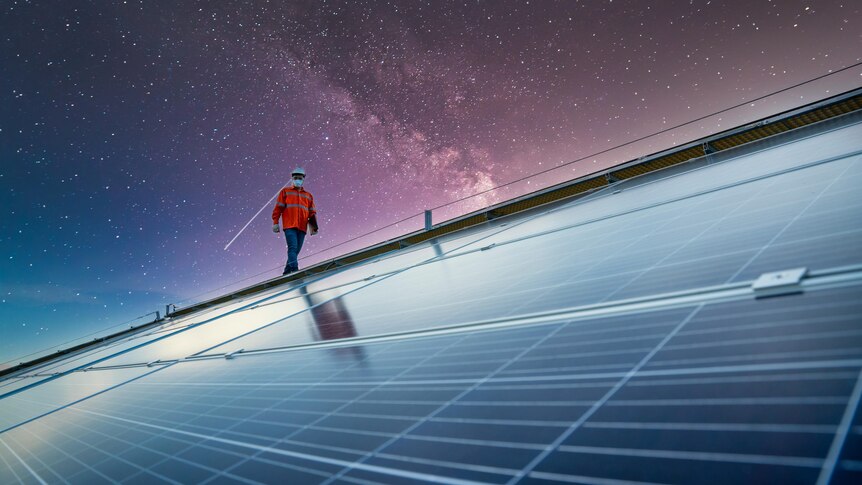 An engineer checks a rooftops solar system