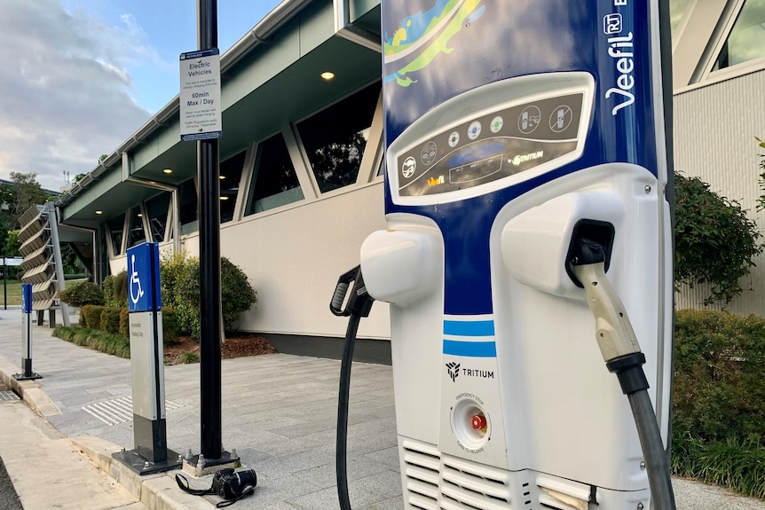 A wide shot of an electric vehicle (EV) charging station.