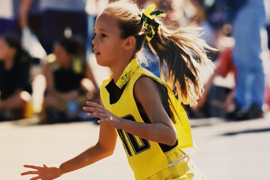 Paige Hadley on the netball court as a young girl.