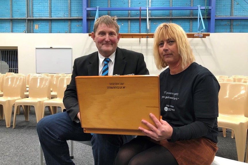 Graeme Chapple and principal Anita Haley with a box of Kenneth Chapple’s notes and paraphernalia