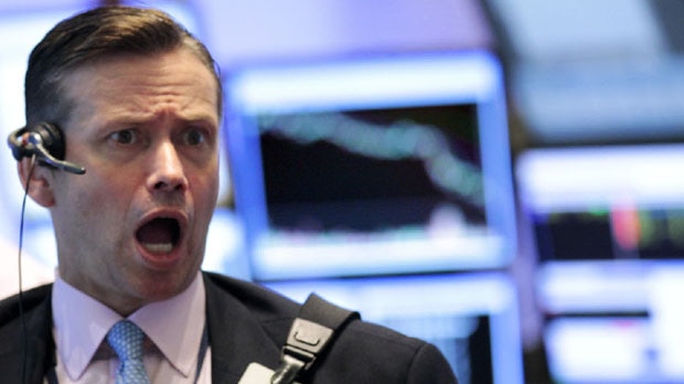 A Wall Street trader looks surprised