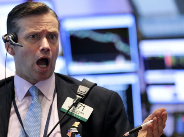 A Wall Street trader looks surprised