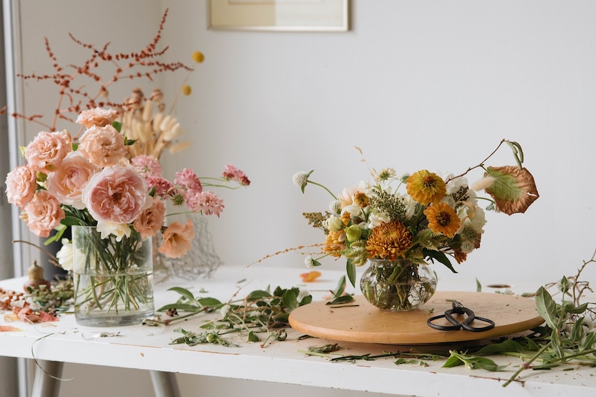 Flowers in vases on a table.