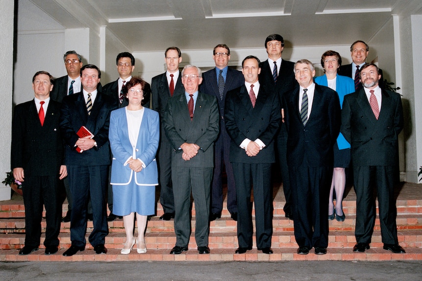 ministers line up on the steps of government house, paul keating centre