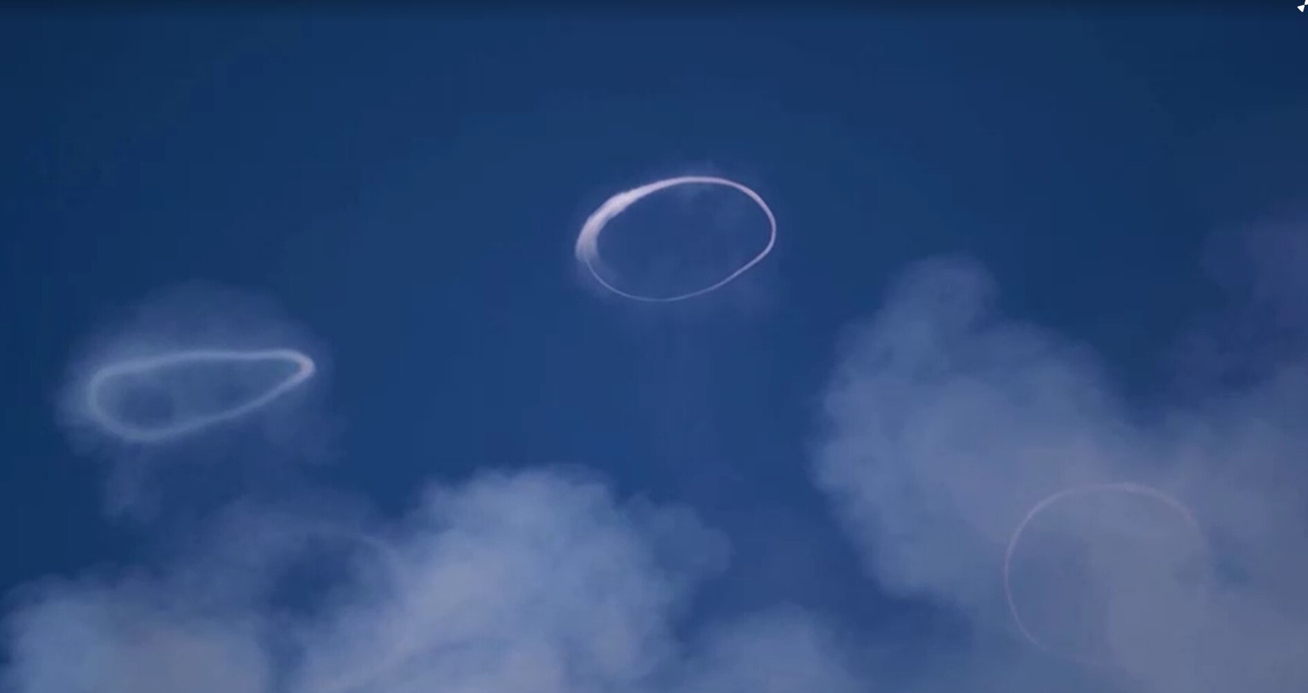 Two white rings can be seen in the sky.