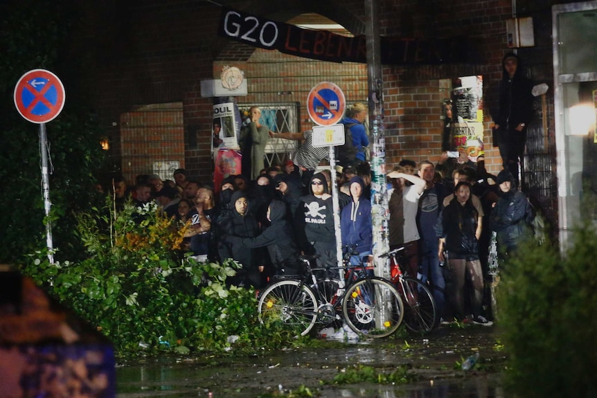 Protesters look for the shelter at the Schanze district.