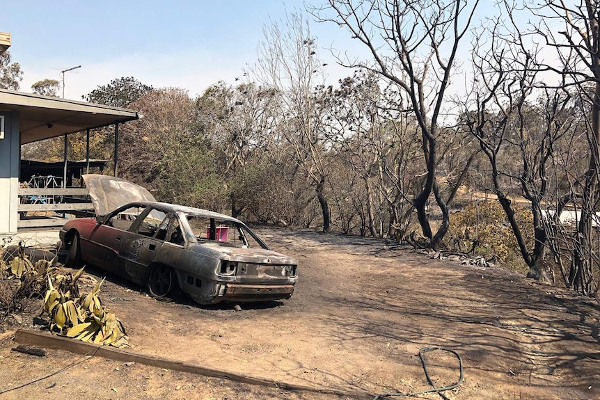 Burnt out car and part of house at Mount Larcom in central Queensland after bushfires in the area.