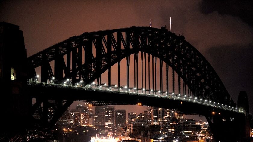 The Harbour Bridge darkens during Earth Hour