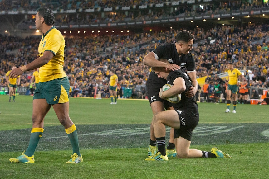 Jack Goodhue and Anton Leinart-Brown celebrate a try for the All Blacks against the Wallabies.