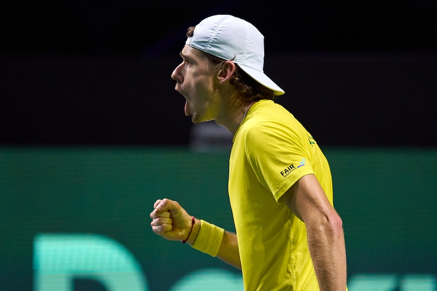 Alex de Minaur clenches his fist and screams