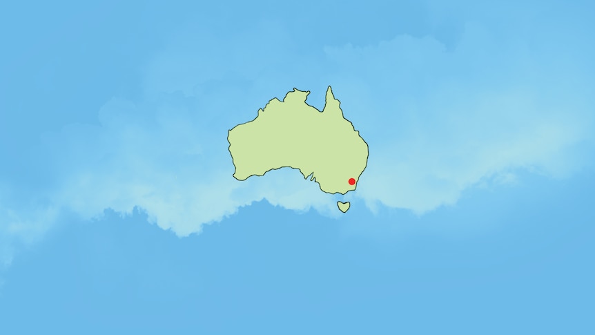 Canberra marked by a red dot on a map of Australia