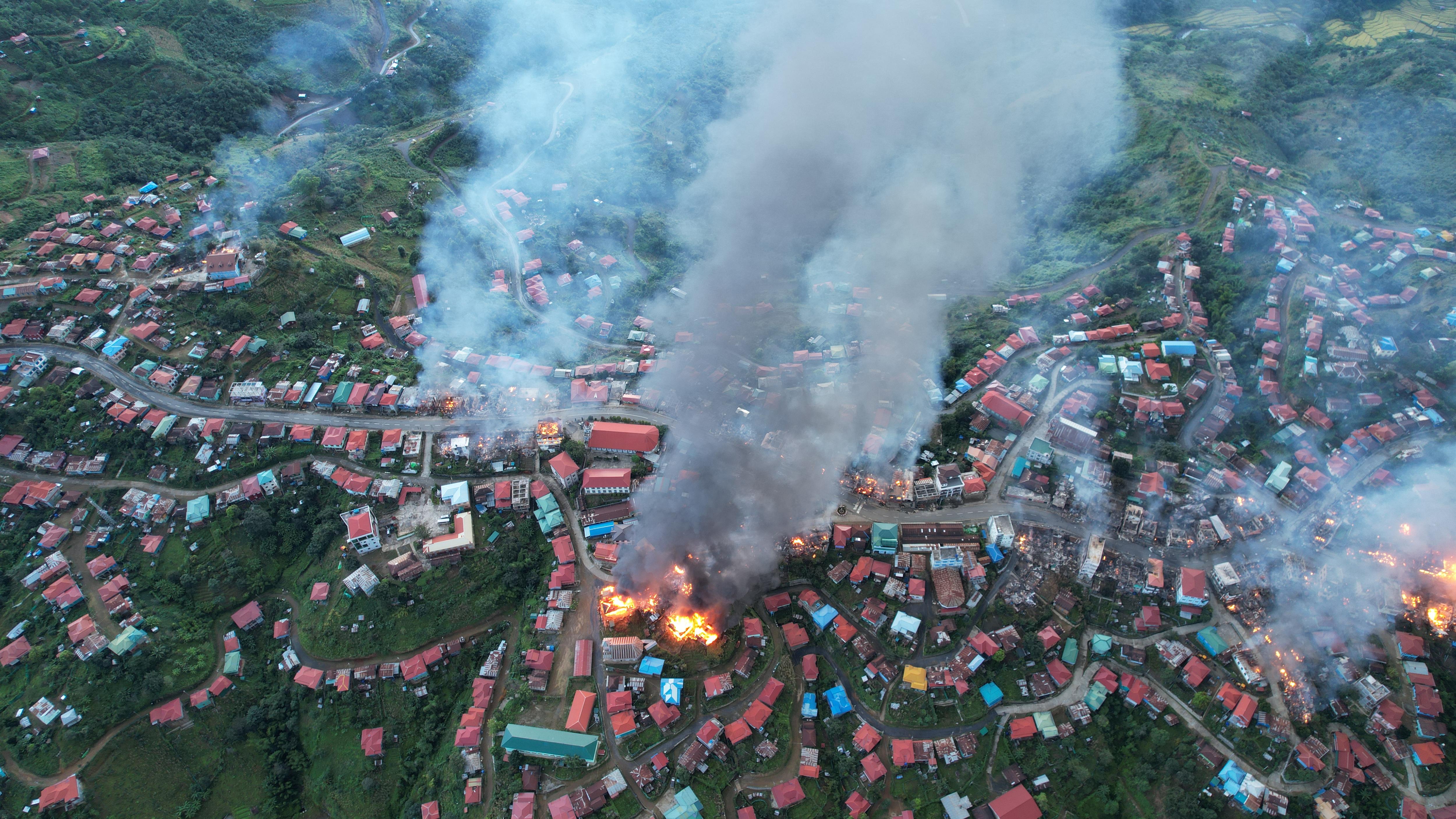 An areial shot of homes burning.
