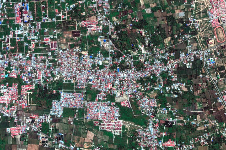 This August 17, 2018, satellite photo provided by DigitalGlobe shows a view of the Petobo neighborhood in Palu, Indonesia.