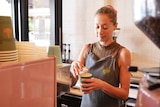Kristy O'Brien makes a takeaway coffee at her business Brinx Café and Deli.