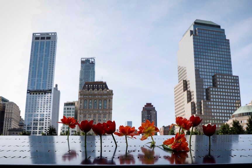 A row of poppies placed in the memorial to the twin towers 