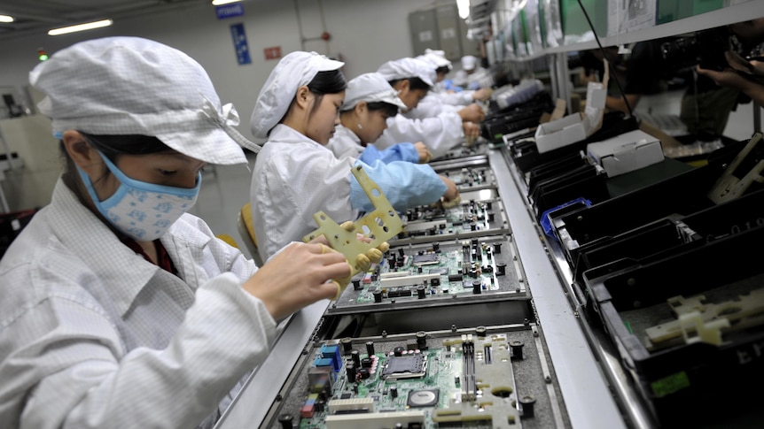 Chinese workers assemble electronic components at the Taiwanese technology giant Foxconn's factory in Shenzhen.