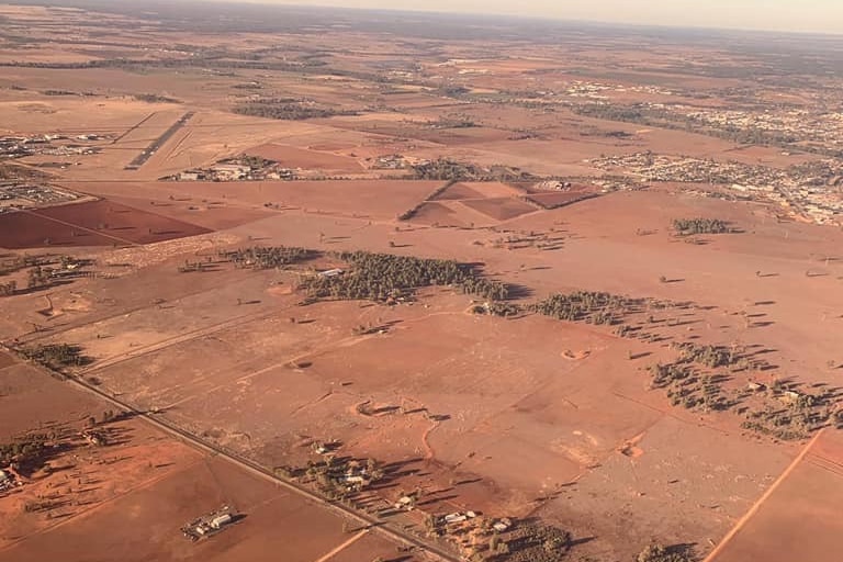 An aerial view of brown land.