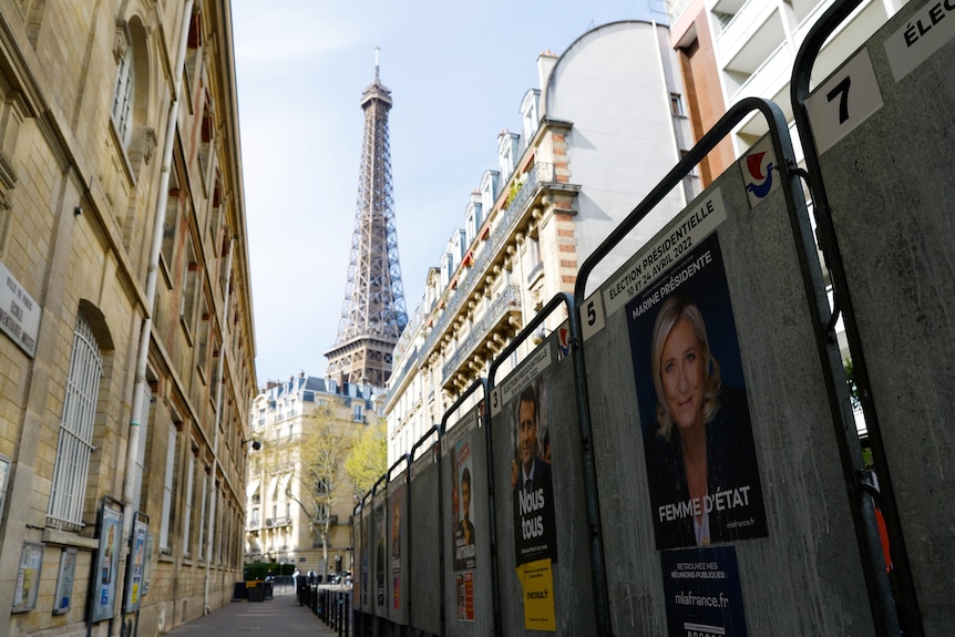 The Eiffel Tower pictured behind posters.