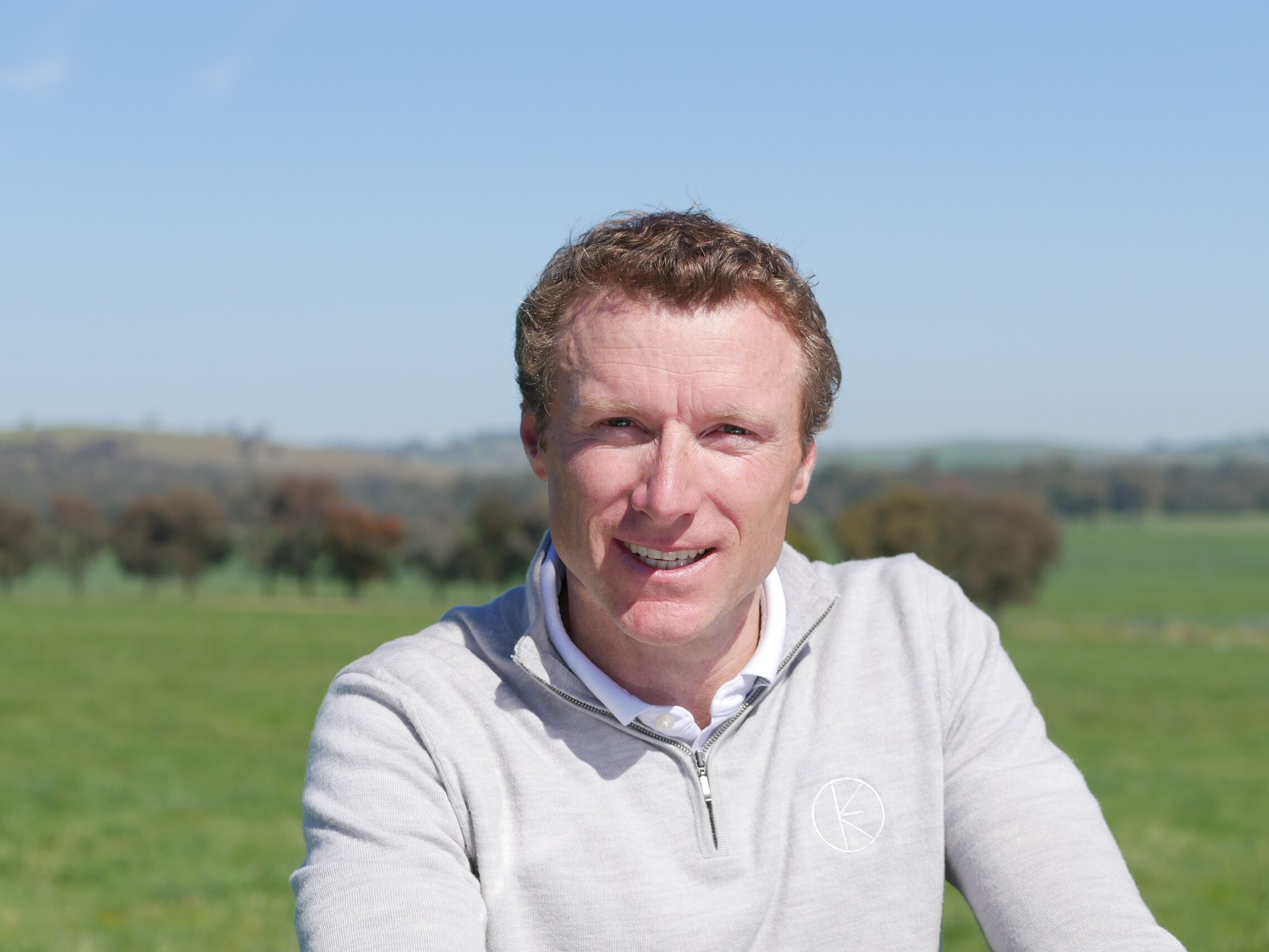 A man in a country field.