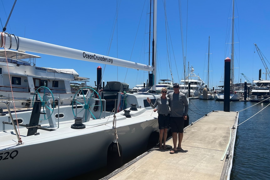 Ocean Crusader co-founders and J-Bird co-skippers Annika and Ian Thomson, standing alongside their renewable vessel.