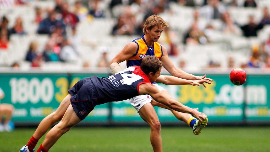 Eagles forward Mark LeCras has his kick smothered against Melbourne in April 2013.