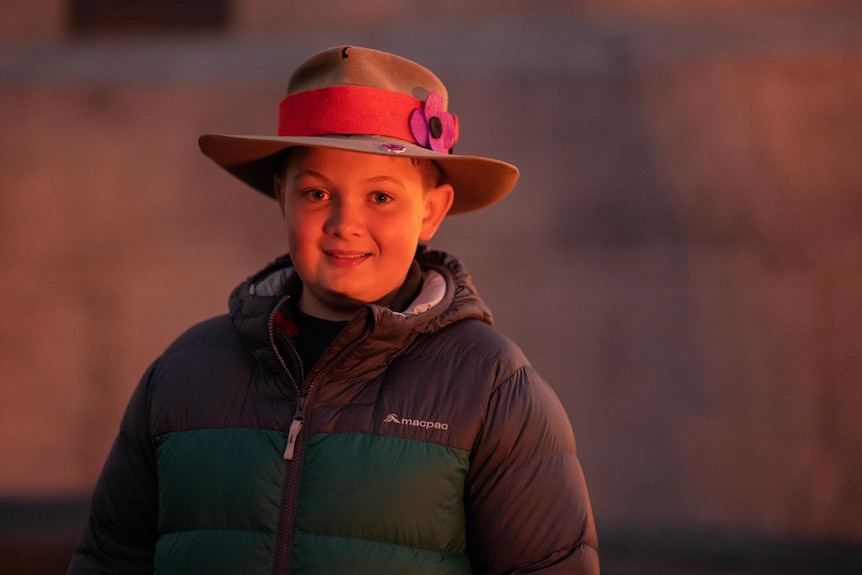 A young boy in a hat on Anzac Day.