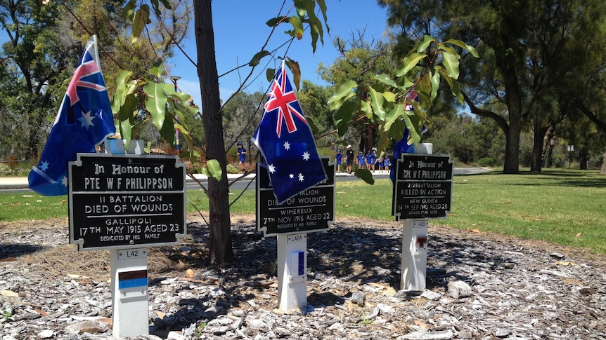 Australian flags on soldier memorial plaques at Kings Park, Remembrance Day 2013