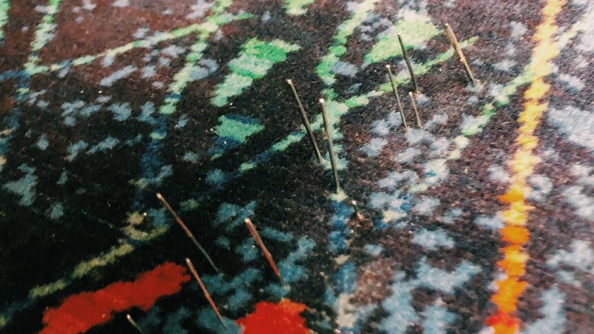 Sewing needles are seen sticking out of a seat on a Metro Train.