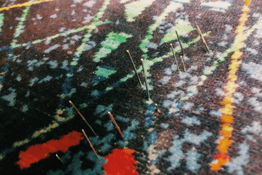 Sewing needles are seen sticking out of a seat on a Metro Train.