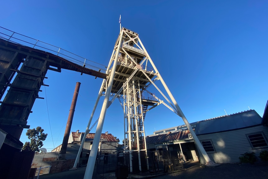 A white poppethead, a tall structure, used for mining back in the Goldfields era. 