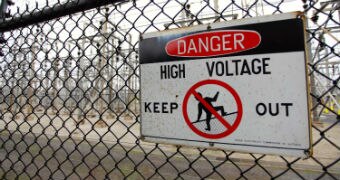 A sign on the fence at an electricity substation in Melbourne reads: "DANGER, HIGH VOLTAGE, KEEP OUT."