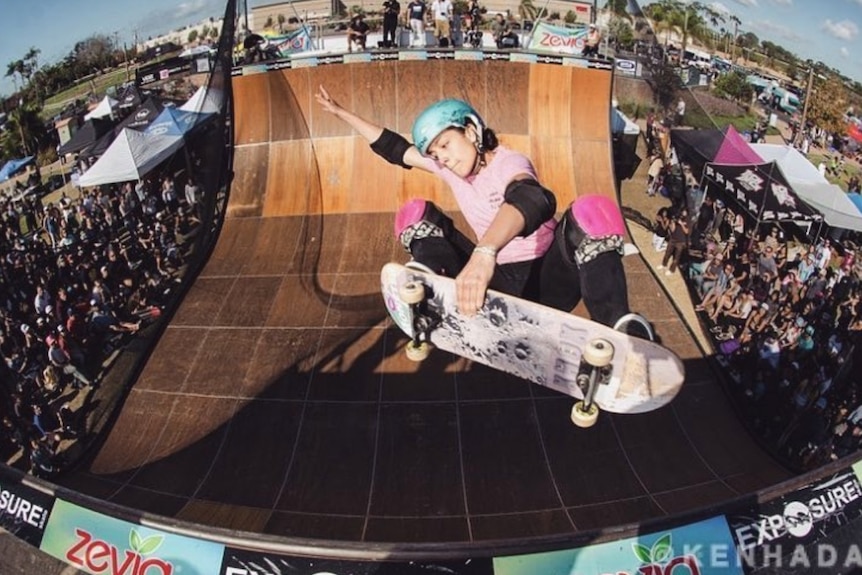 Sydney's Amar Hadid skating at the top of a half-pipe.