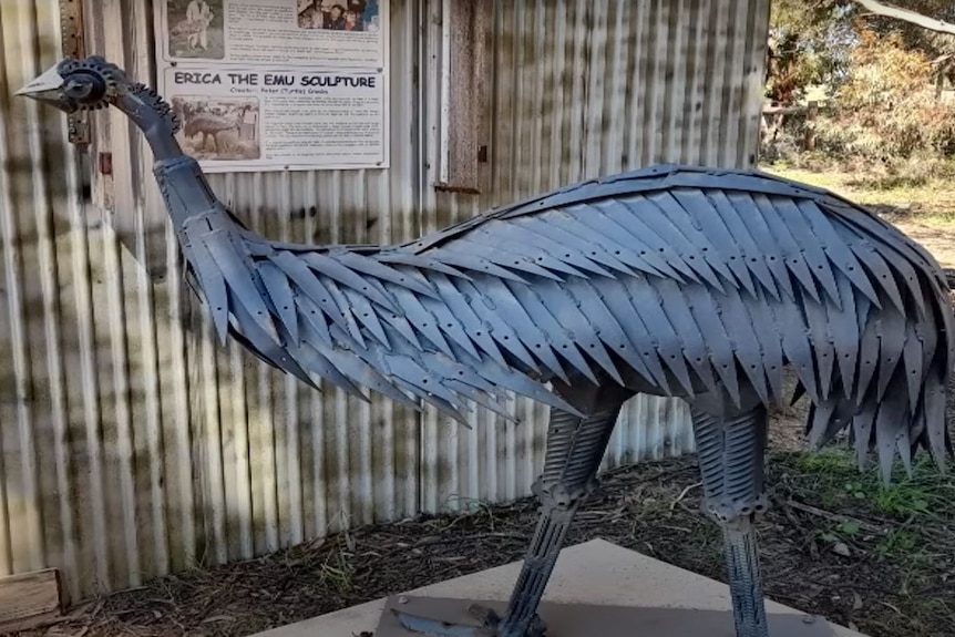 A metal sculpture in the shape of an emu
