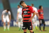 A dejected Nicolas Martinez reflects on the Wanderers' draw with the victory after the full-time siren.