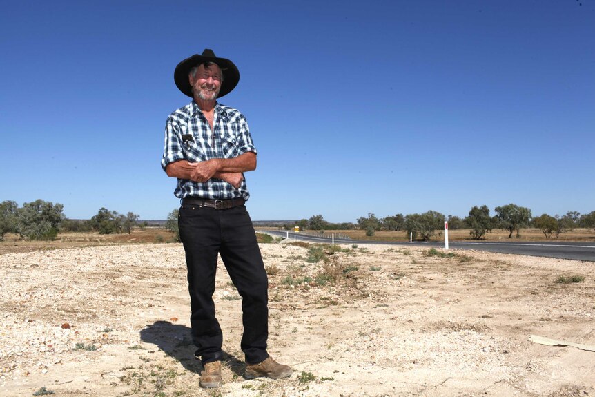 David Elliott stands in front of road in Winton newly named Butch Lenton Way