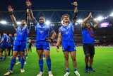A group of rugby league players thank the crowd