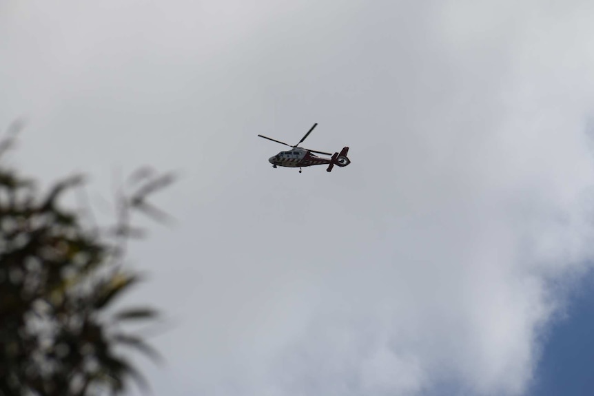 An ambulance helicopter flies over the Melbourne Youth Justice Centre, where inmates are rioting.