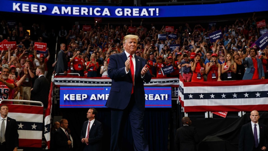 President Donald Trump arrives to speak at his re-election kick-off rally.