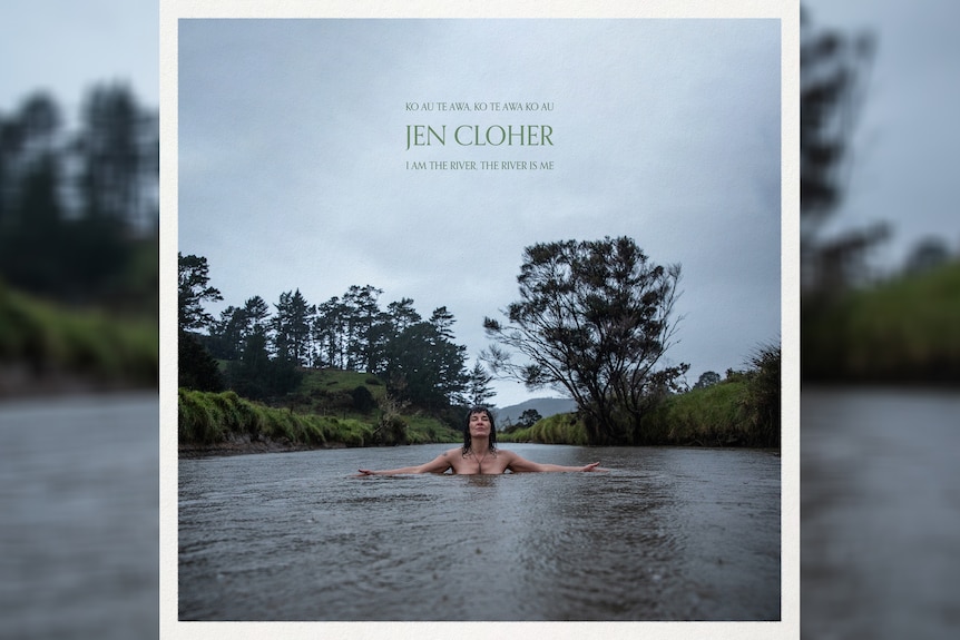 Jen Cloher bathes, arms outstretched, in a river surrounded by grey skies and trees on the bank